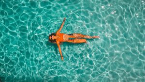 Women laying in the water.