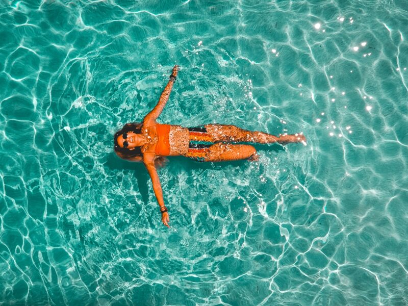 Women laying in the water.